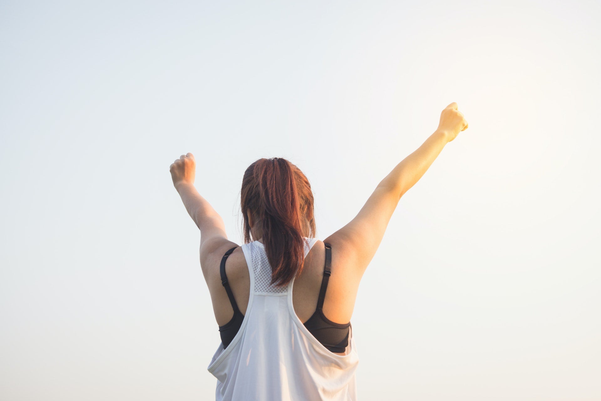 Excited Girl raising her hands | Fuelled Nutrition